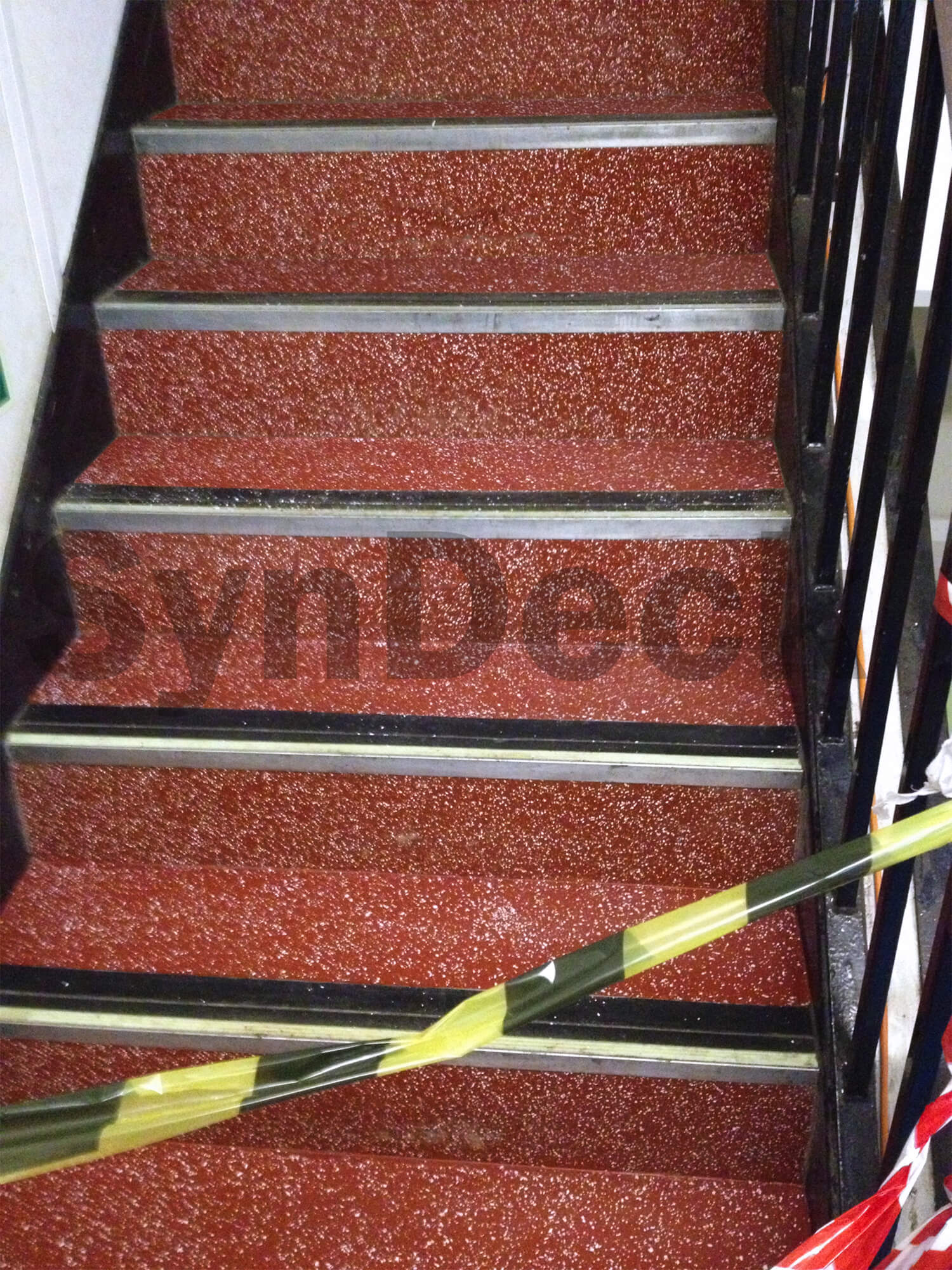 Image of In Progress SynDeck Epoxy System with Flake in Red on Ferry Stairs