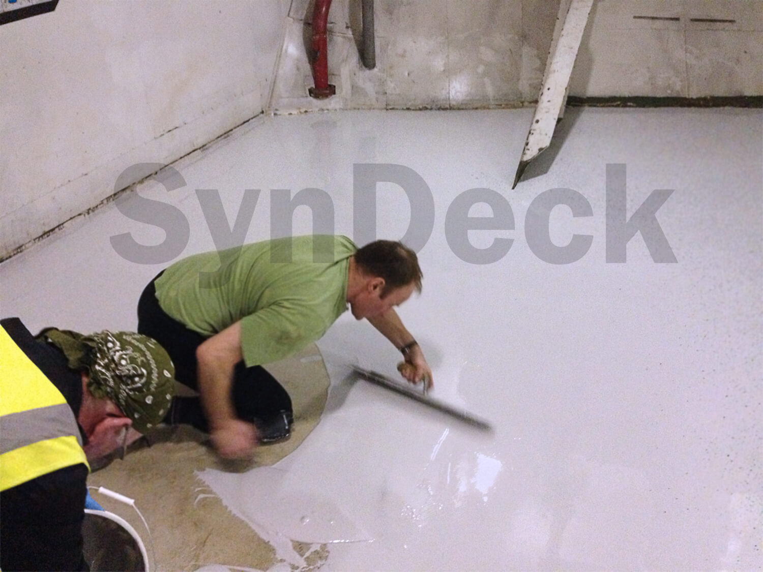 Image of Application of SynDeck Flex IMO System Grey with Flake on Navy Gym Floor