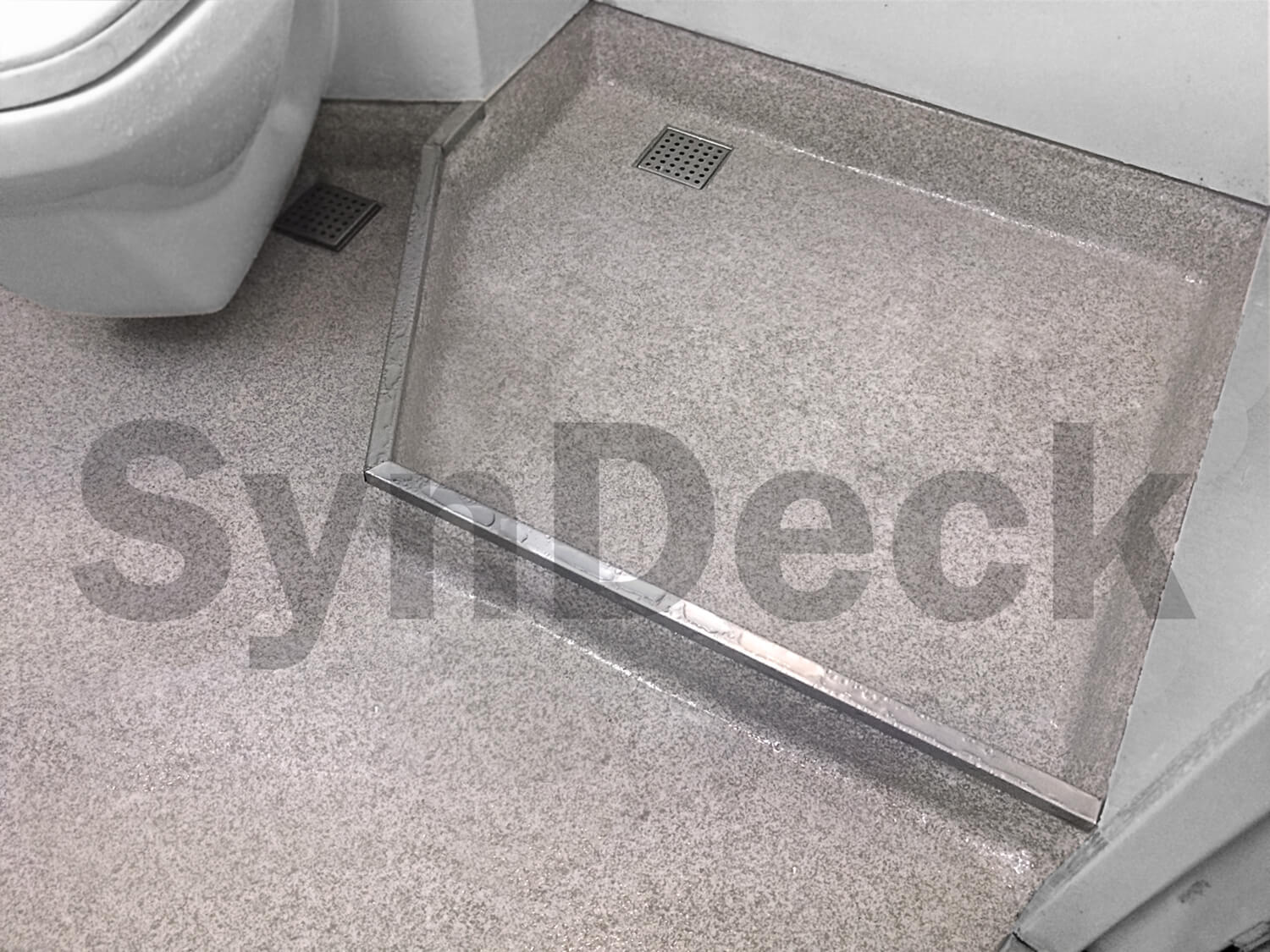 Image of Completed SynDeck Ultra Lightweight Terrazzo System in Beige, White and Grey on Ship Shower/Head
