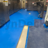 Application in Progress of SynDeck IMO Epoxy SS5000 Navy Blue 5015 over Blue Quartz, 1st Colored Seal Layer on an Offshore Oil Rig Galley